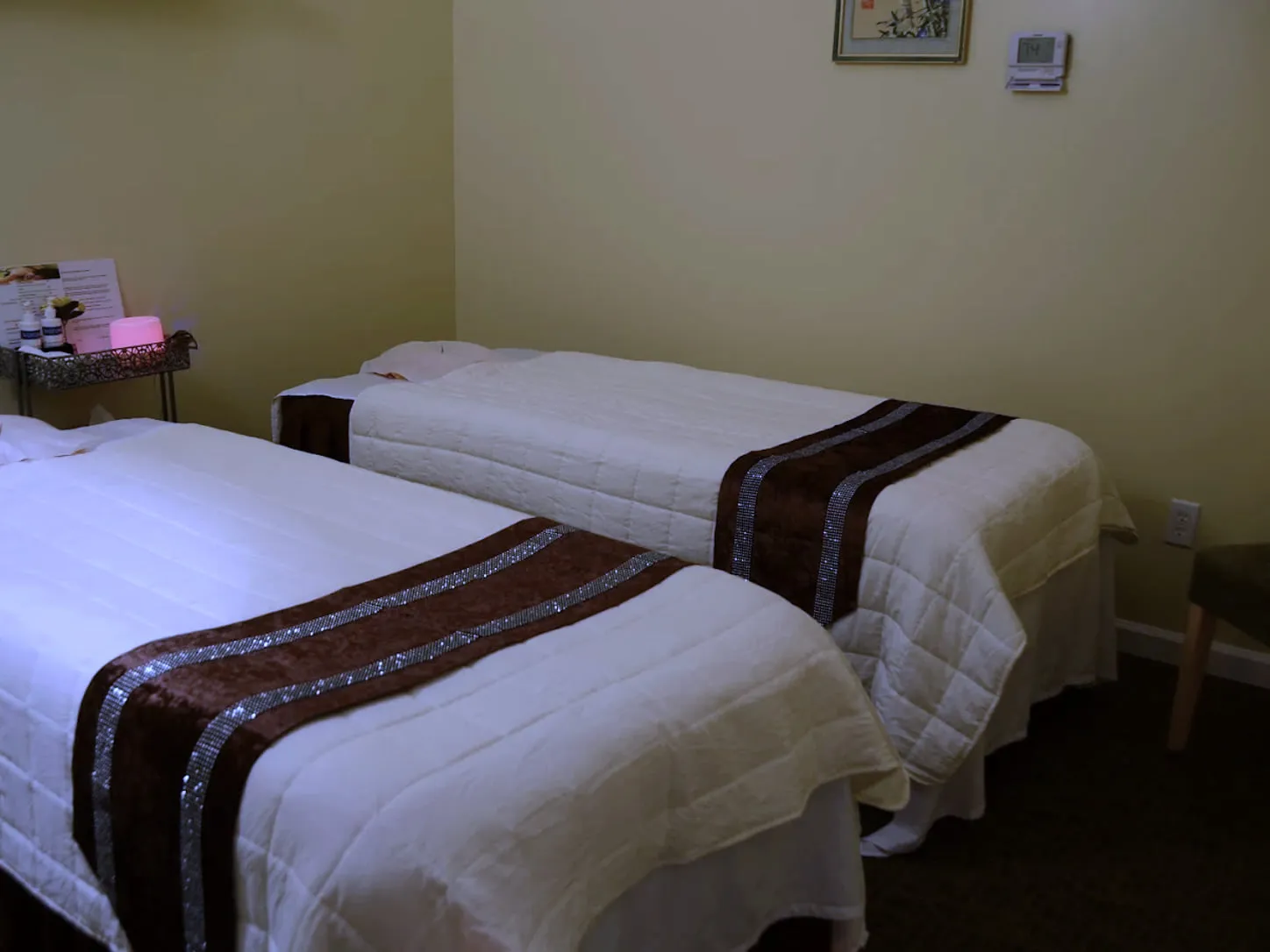The couples room at LJY Reflexology in Hermitage, two massage tables made up side by side